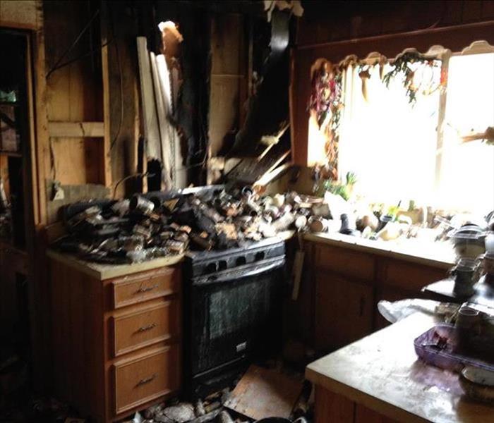 Kitchen with charred debris on the stove
